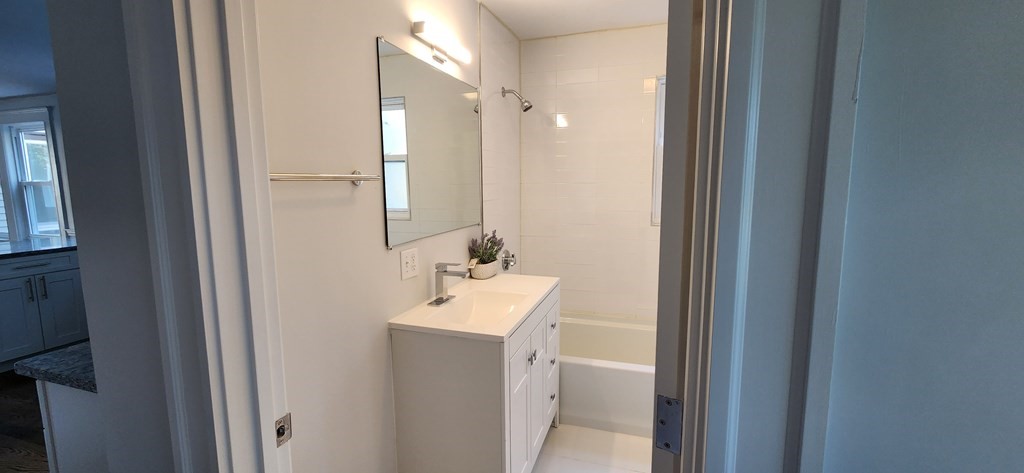 38 Kimball Road, Unit 2 Watertown, MA 02472 - Photo 12 of 29 a bathroom with a sink a toilet and shower