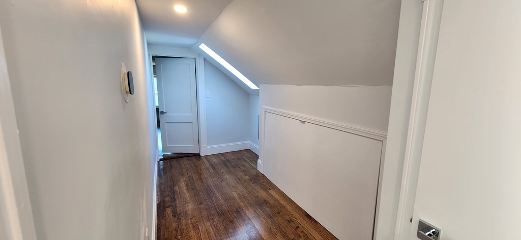 38 Kimball Road, Unit 2 Watertown, MA 02472 - Photo 13 of 29 a view of hallway with wooden floor