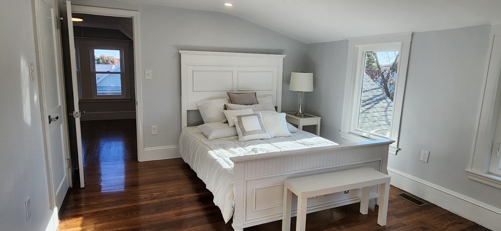 38 Kimball Road, Unit 2 Watertown, MA 02472 - Photo 16 of 29 a bedroom with a bed and a mirror