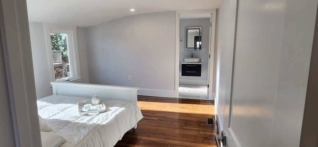 38 Kimball Road, Unit 2 Watertown, MA 02472 - Photo 17 of 29 a living room with furniture and wooden floor