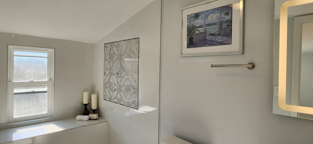 38 Kimball Road, Unit 2 Watertown, MA 02472 - Photo 20 of 29 a view of a bathroom with a shower and a window