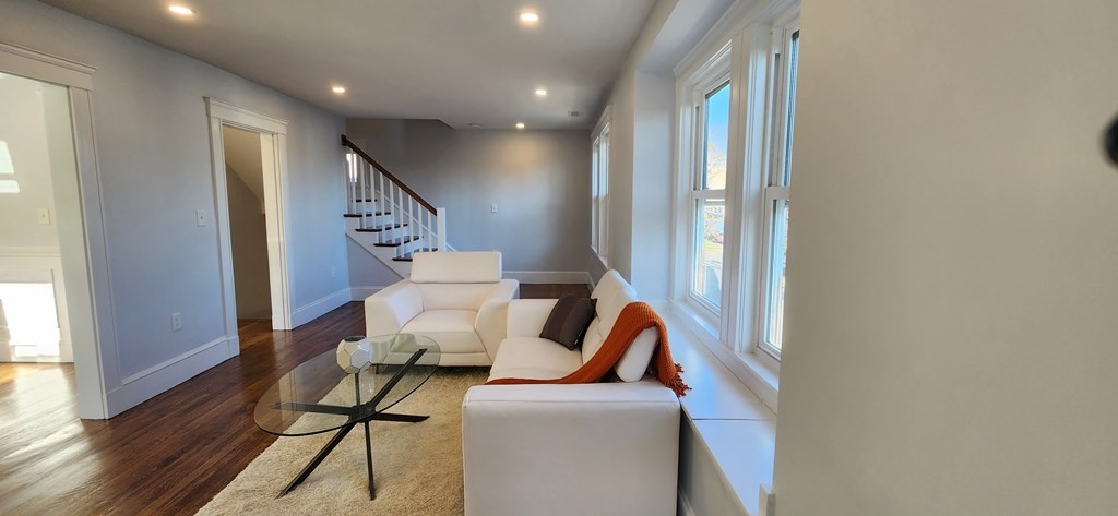 38 Kimball Road, Unit 2 Watertown, MA 02472 - Photo 2 of 29 a living room with furniture and a large window