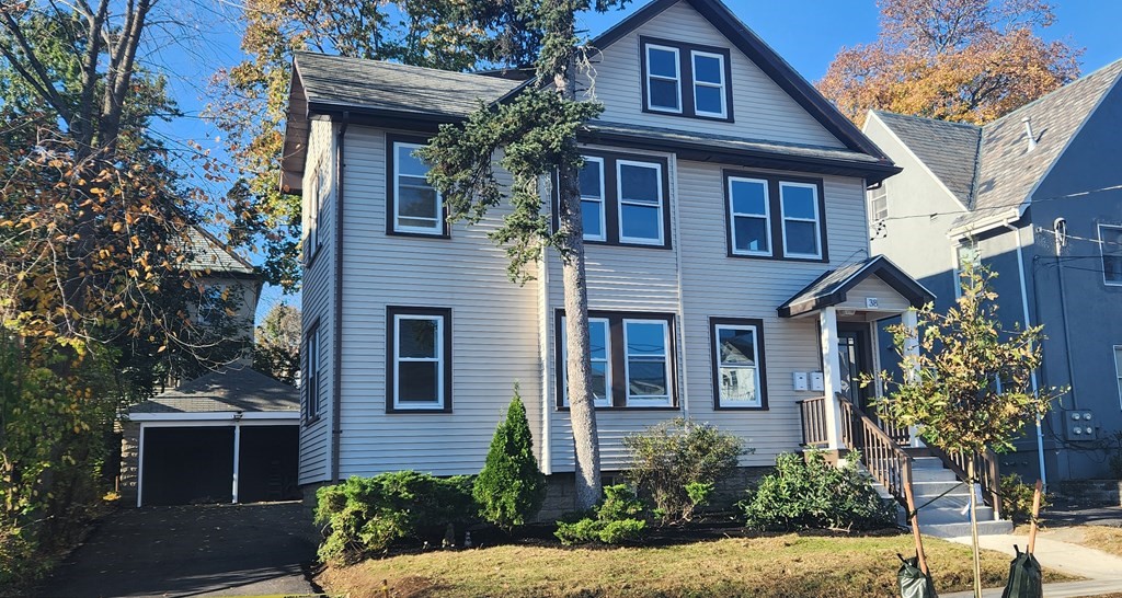 38 Kimball Road, Unit 2 Watertown, MA 02472 - Photo 22 of 29 a front view of a house with garden