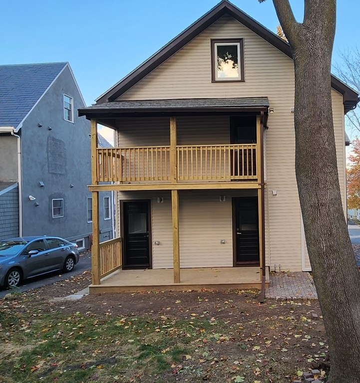 38 Kimball Road, Unit 2 Watertown, MA 02472 - Photo 24 of 29 a front view of a house with a yard