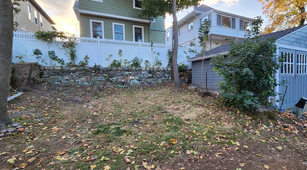 38 Kimball Road, Unit 2 Watertown, MA 02472 - Photo 25 of 29 a view of a brick house next to a yard