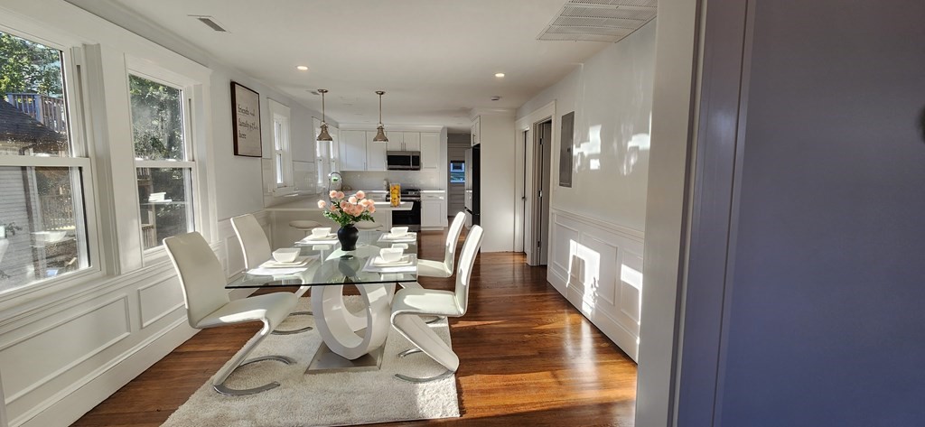 38 Kimball Road, Unit 2 Watertown, MA 02472 - Photo 3 of 29 a view of a dining room with furniture wooden floor and a chandelier