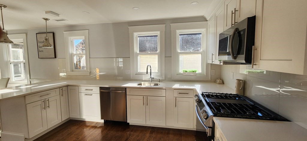 38 Kimball Road, Unit 2 Watertown, MA 02472 - Photo 7 of 29 a kitchen with a sink stove and microwave