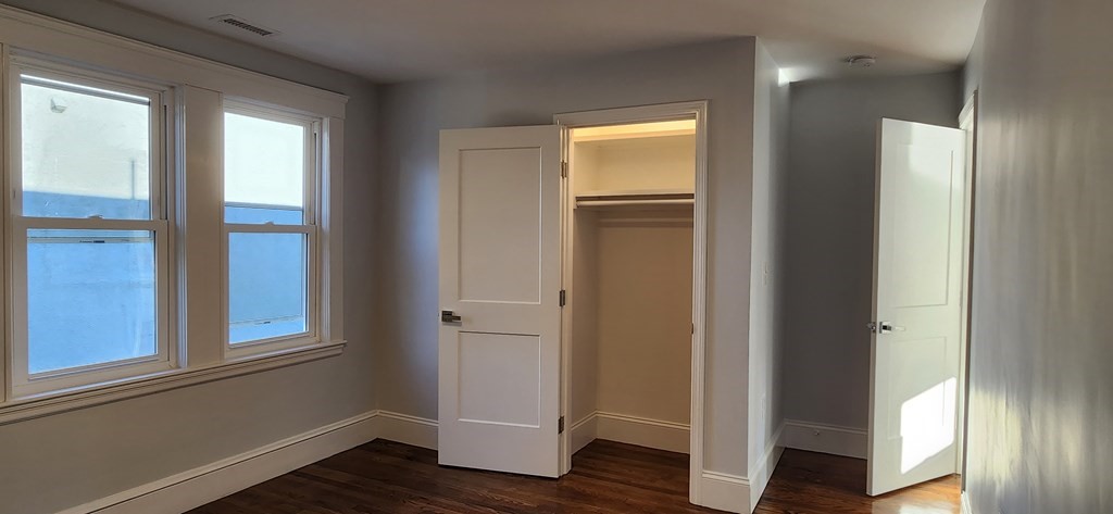 38 Kimball Road, Unit 2 Watertown, MA 02472 - Photo 10 of 29 a view of empty room with wooden floor and fan