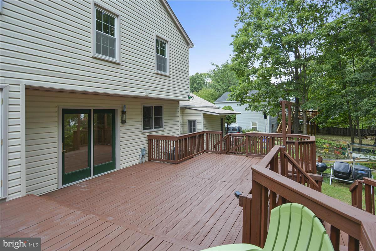15212 Philip Lee Road Chantilly, VA 20151 - Photo 29 of 30 a view of house with deck and outdoor seating