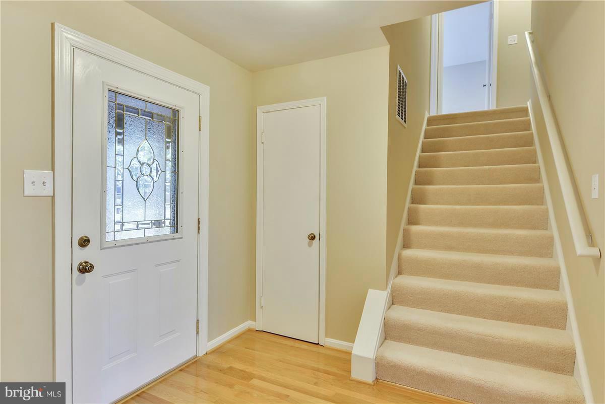 15212 Philip Lee Road Chantilly, VA 20151 - Photo 4 of 30 a view of an entryway with wooden floor