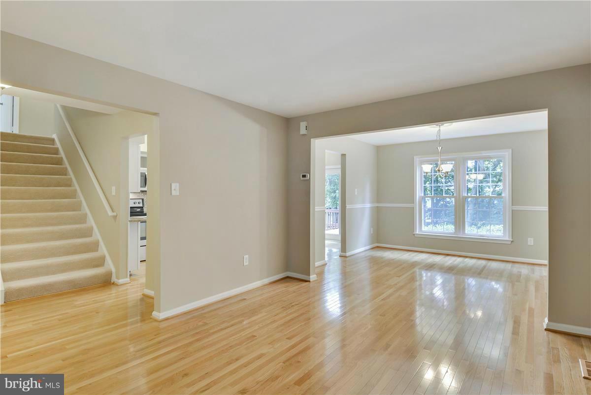15212 Philip Lee Road Chantilly, VA 20151 - Photo 9 of 30 a view of an empty room with wooden floor and a window