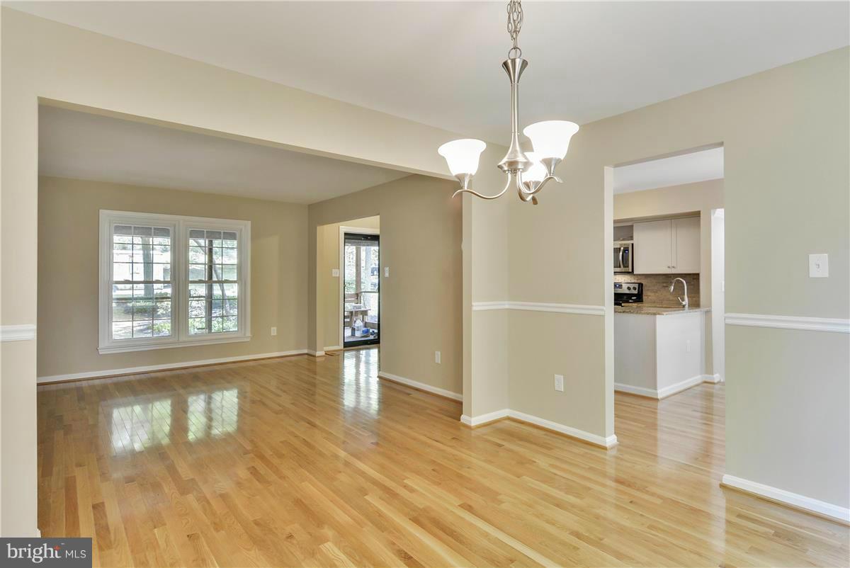 15212 Philip Lee Road Chantilly, VA 20151 - Photo 10 of 30 a view of an empty room with wooden floor and a window