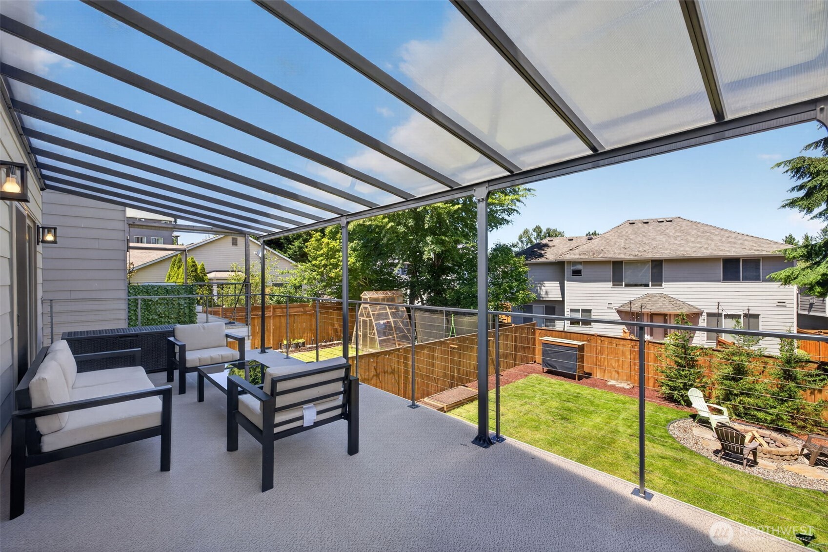 629 Bing Road, Unit B Lynnwood, WA 98036 - Photo 9 of 27 a outdoor space with the couches and dining table under an umbrella