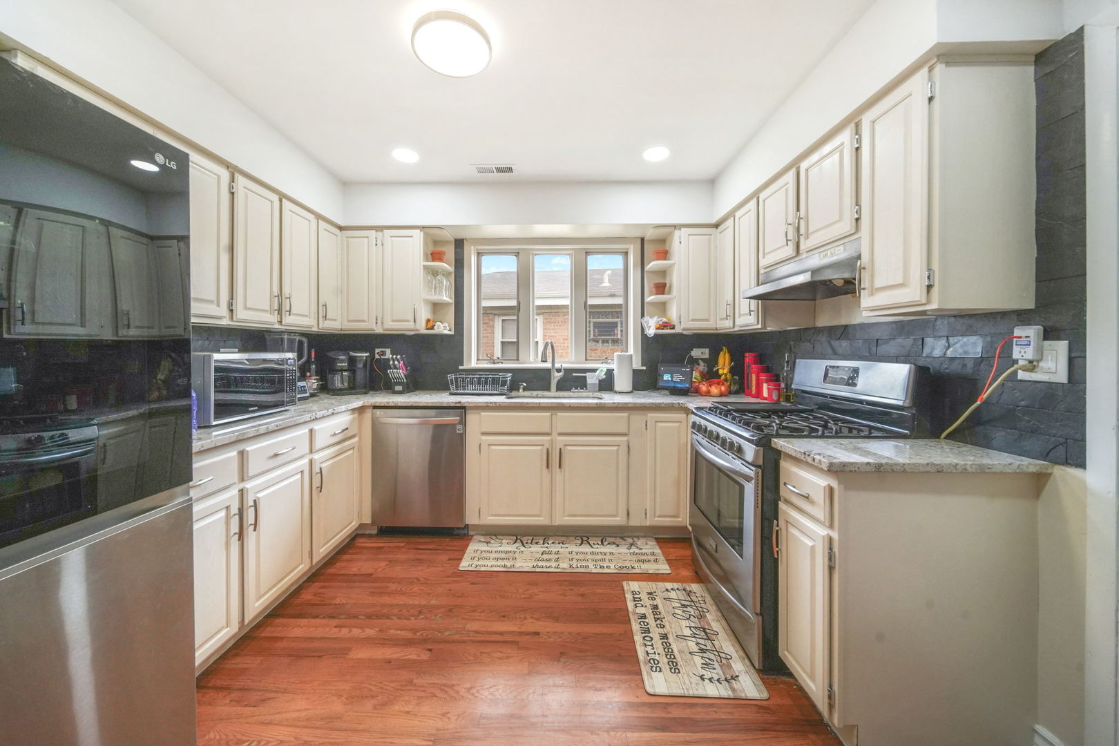 7235 Park Avenue Summit, IL 60501 - Photo 13 of 30 a kitchen with a white cabinets and white appliances
