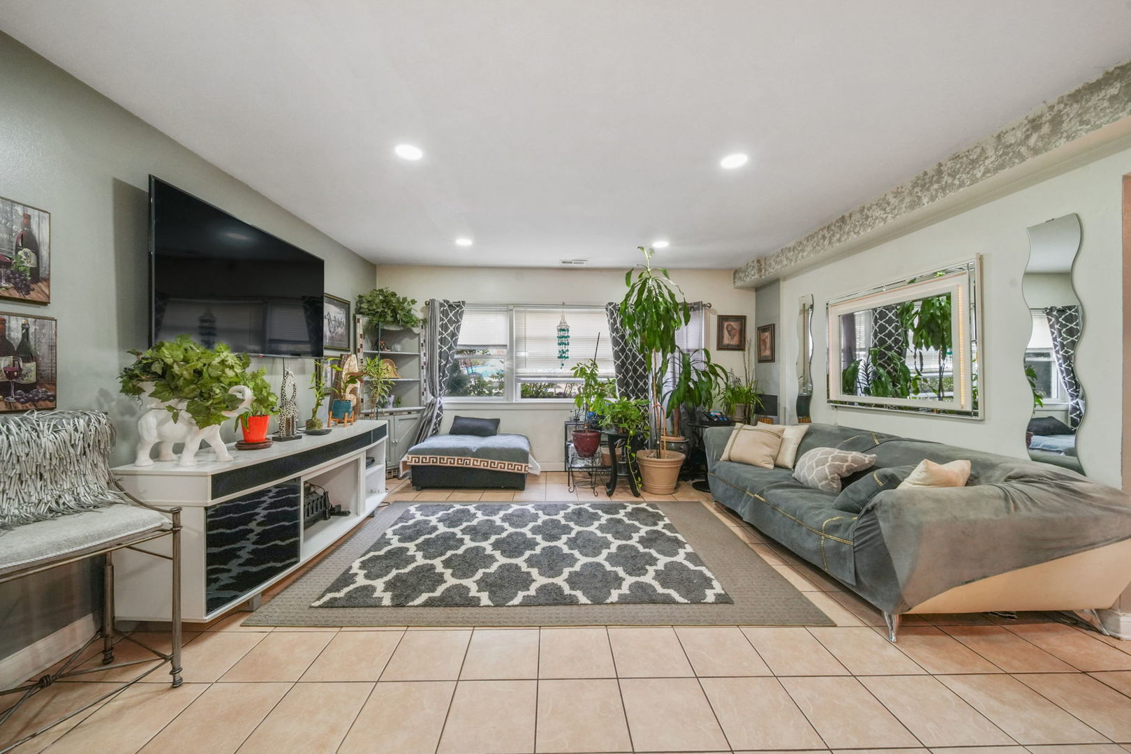 7235 Park Avenue Summit, IL 60501 - Photo 20 of 30 a living room with furniture and a flat screen tv