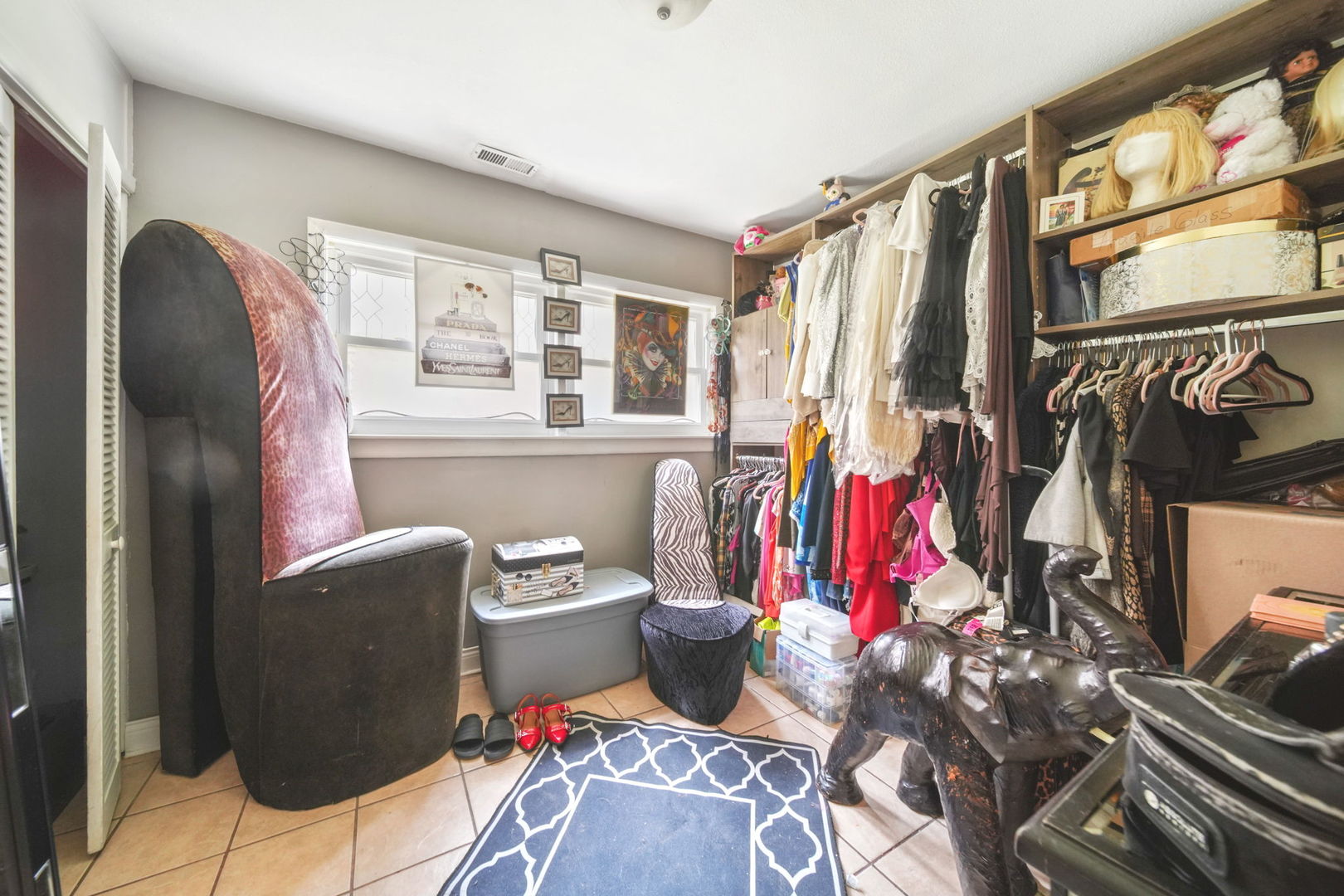 7235 Park Avenue Summit, IL 60501 - Photo 23 of 30 a view of walk in closet with clothes and shoes