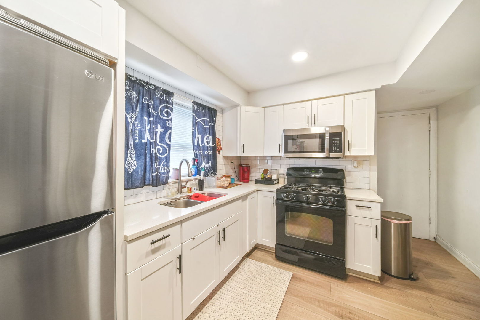 7235 Park Avenue Summit, IL 60501 - Photo 25 of 30 a kitchen with a stove sink and refrigerator