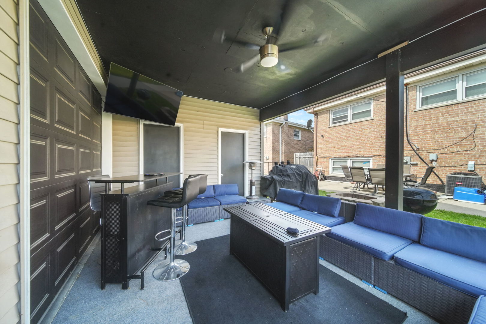 7235 Park Avenue Summit, IL 60501 - Photo 26 of 30 a living room with furniture and a floor to ceiling window