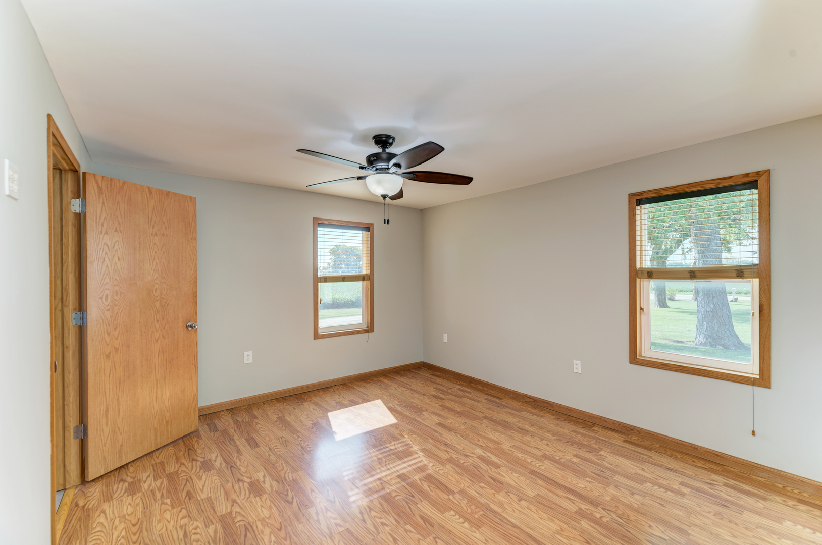 17357 Sedgewick Road Plano, IL 60545 - Photo 16 of 36 a view of empty room with wooden floor and fan