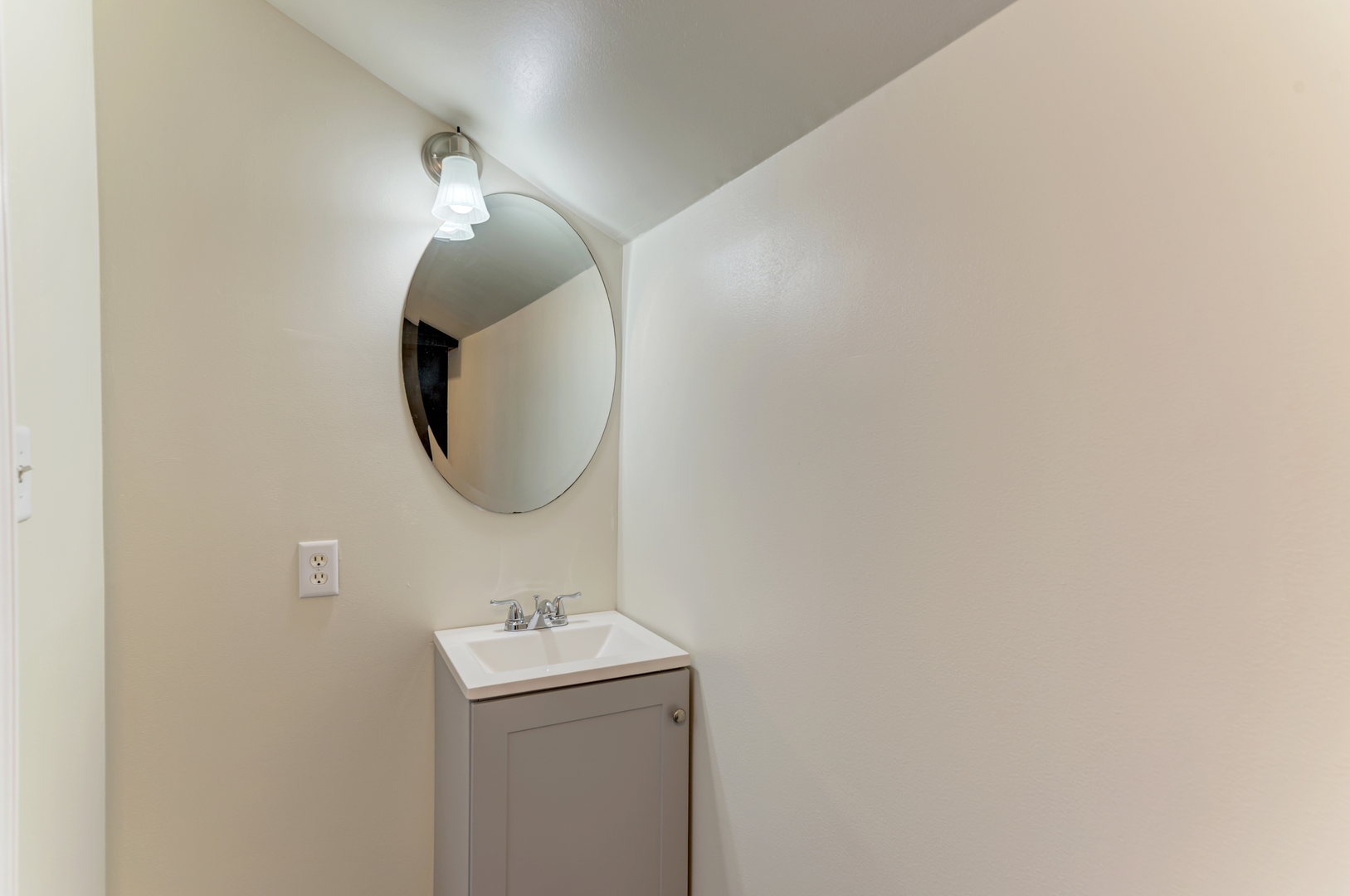 17357 Sedgewick Road Plano, IL 60545 - Photo 23 of 36 a bathroom with a sink and mirror