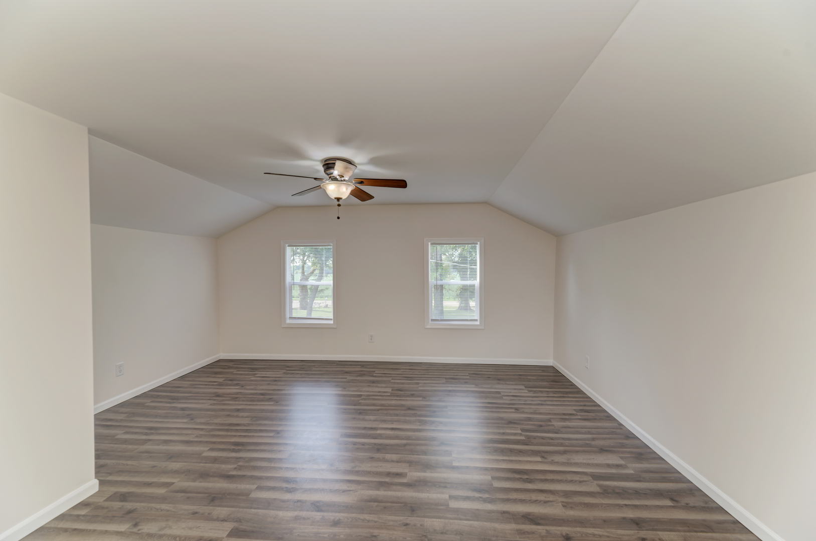 17357 Sedgewick Road Plano, IL 60545 - Photo 25 of 36 a view of empty room with wooden floor and fan