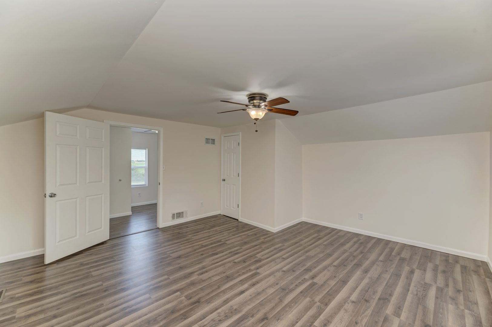 17357 Sedgewick Road Plano, IL 60545 - Photo 26 of 36 wooden floor in an empty room with a window