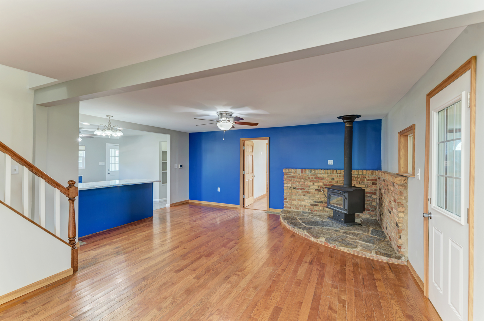 17357 Sedgewick Road Plano, IL 60545 - Photo 6 of 36 a view of an empty room with window and wooden floor