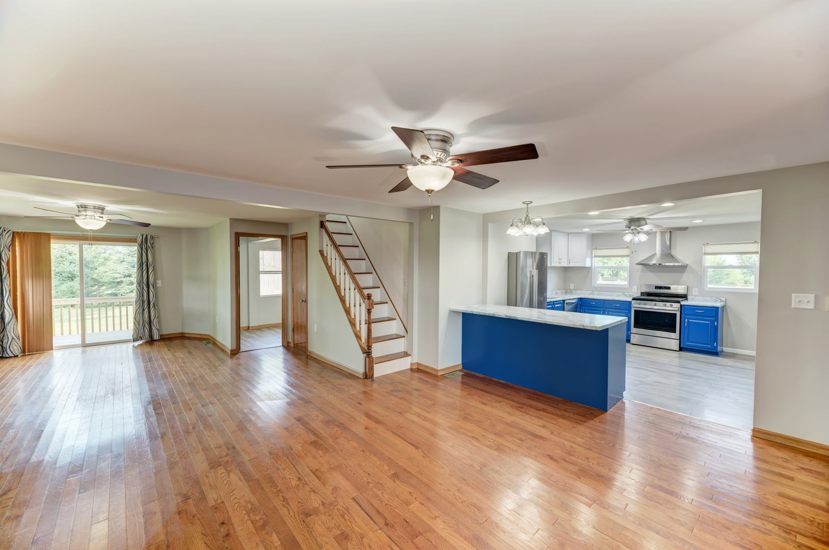 17357 Sedgewick Road Plano, IL 60545 - Photo 8 of 36 a view of an empty room with window and wooden floor