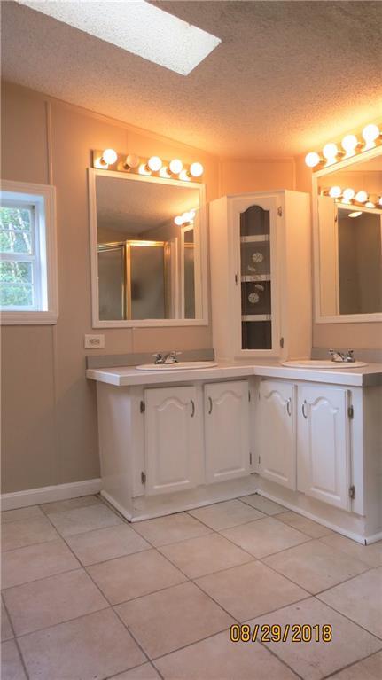 34 Winslow Road Naples, ME 04055 - Photo 19 of 29 The master bath offers two sinks and...