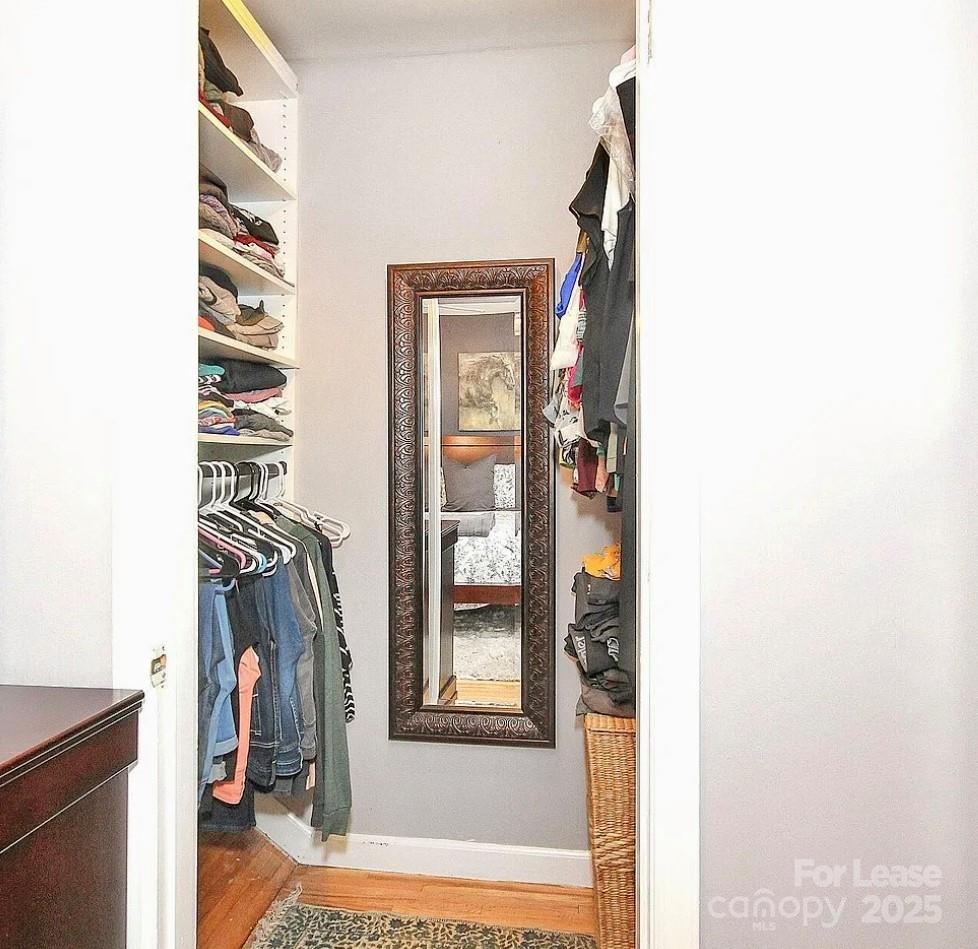 858 McAlway Road, Unit A Charlotte, NC 28211 - Photo 16 of 20 a view of a hallway with wooden floor and windows