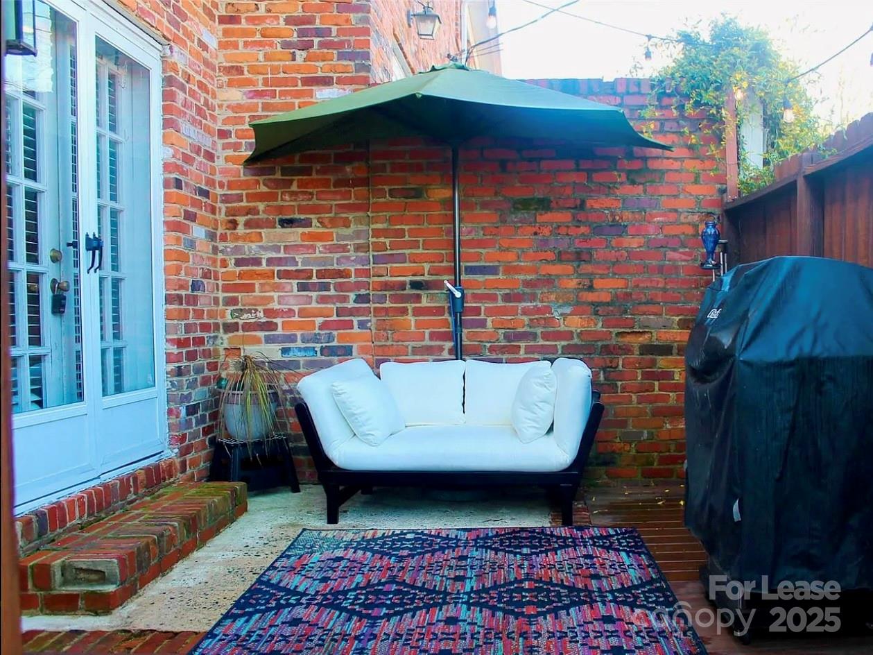 858 McAlway Road, Unit A Charlotte, NC 28211 - Photo 7 of 20 a front view of a house with outdoor seating