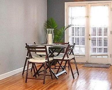 858 McAlway Road, Unit A Charlotte, NC 28211 - Photo 10 of 20 a view of a dining room with furniture window and wooden floor