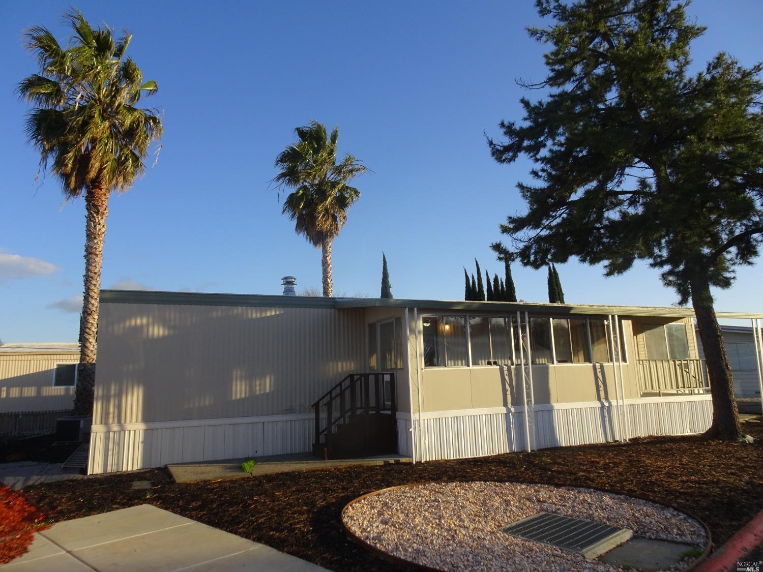 a house with trees in the background
