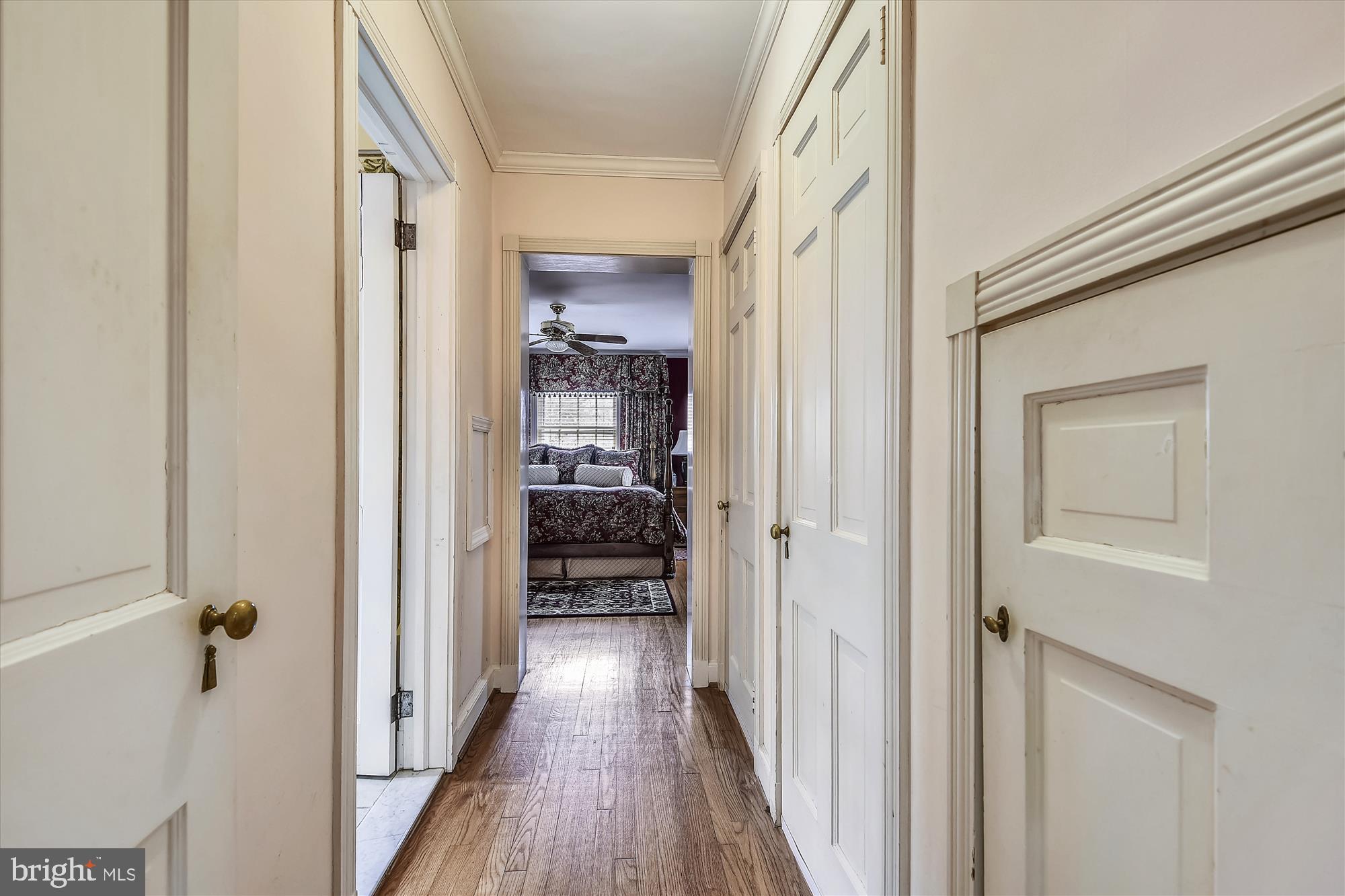 5209 Springlake Way Baltimore, MD 21212 - Photo 22 of 57 a view of a hallway with a wooden door