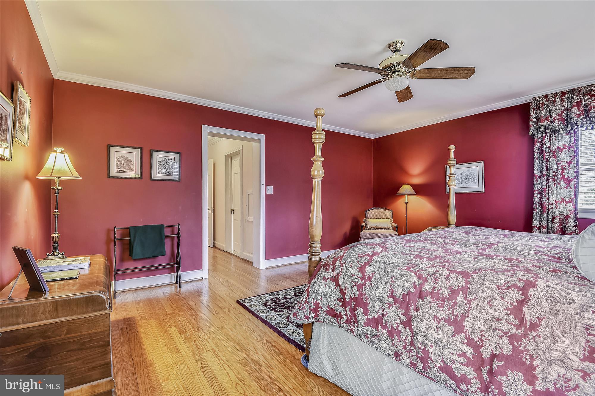 5209 Springlake Way Baltimore, MD 21212 - Photo 24 of 57 a bedroom with a bed and a chandelier