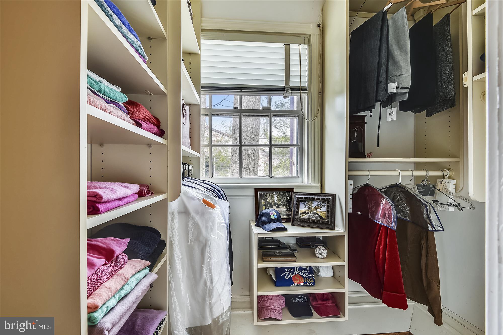 5209 Springlake Way Baltimore, MD 21212 - Photo 25 of 57 a view of walk in closet with clothes and shoes