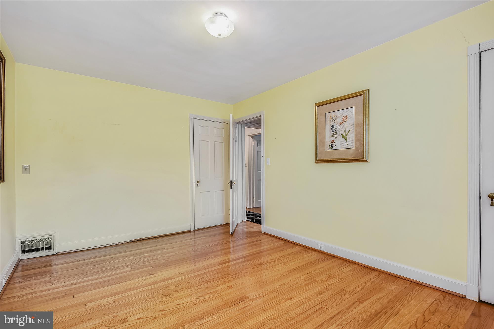 5209 Springlake Way Baltimore, MD 21212 - Photo 29 of 57 a view of an empty room with wooden floor
