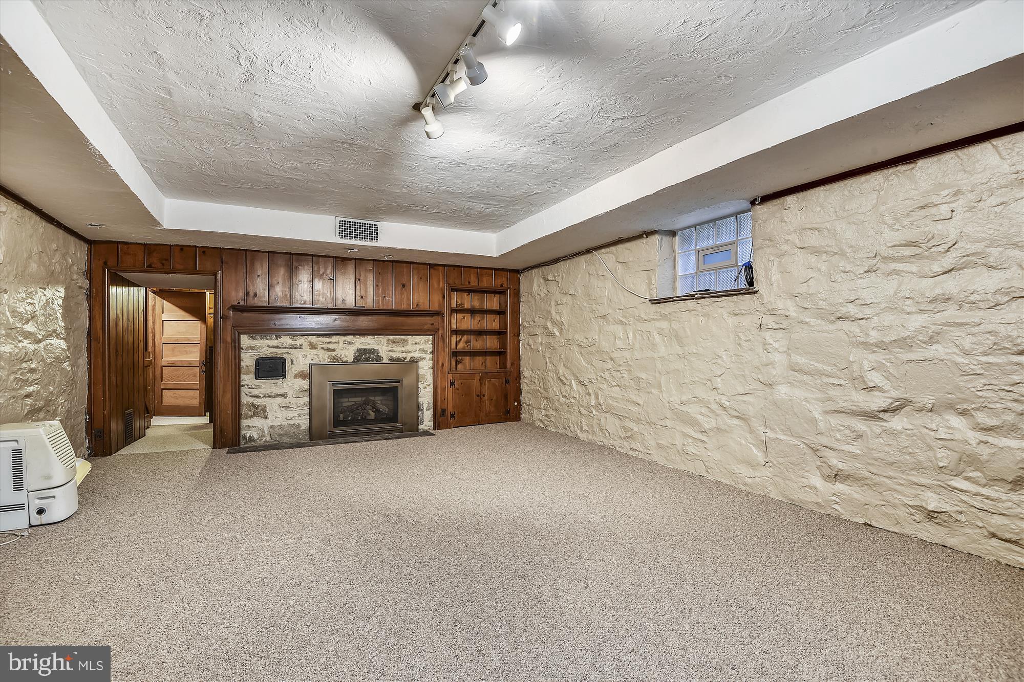 5209 Springlake Way Baltimore, MD 21212 - Photo 36 of 57 a view of an empty room with a fireplace