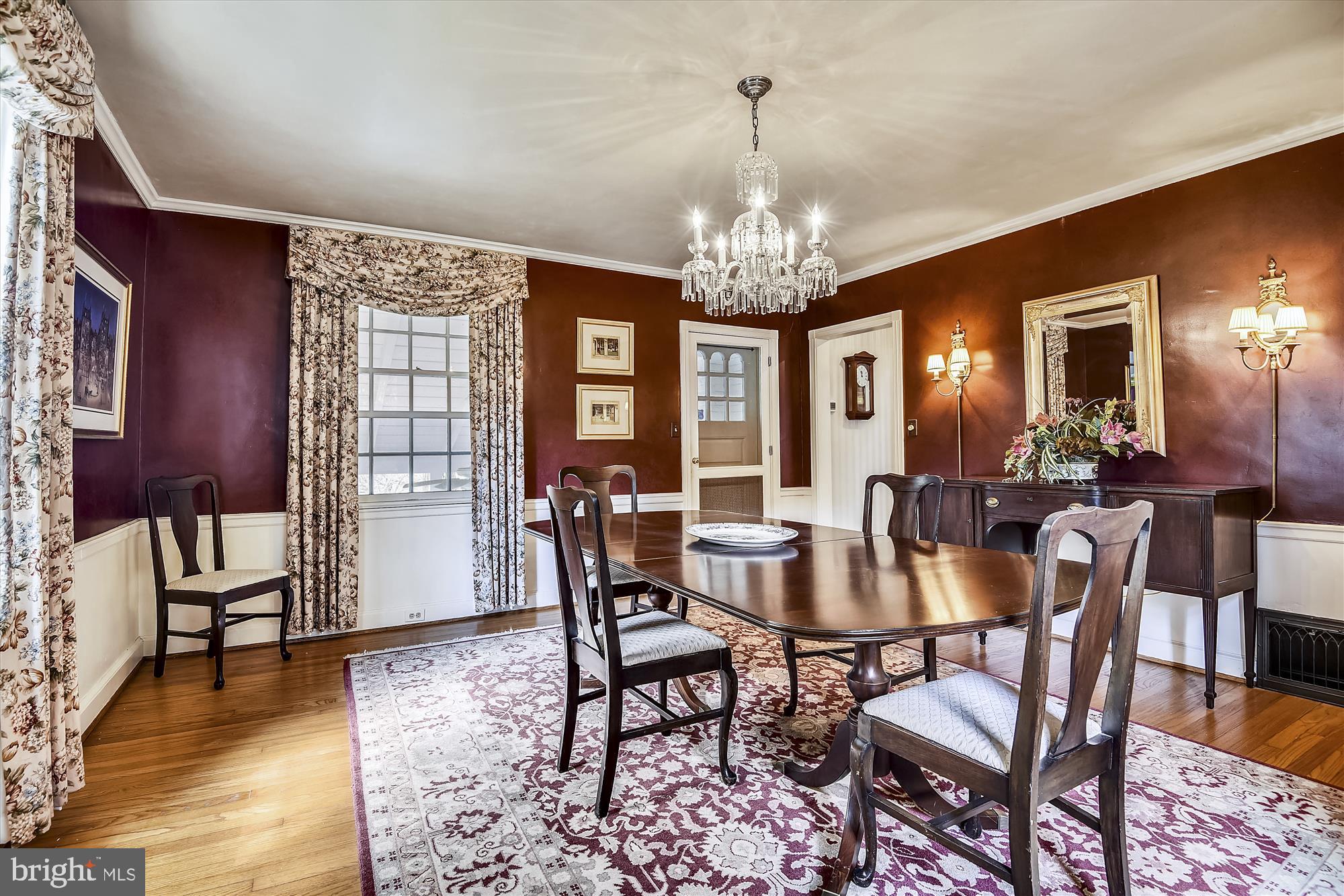 5209 Springlake Way Baltimore, MD 21212 - Photo 10 of 57 a view of a dining room with furniture a chandelier and wooden floor