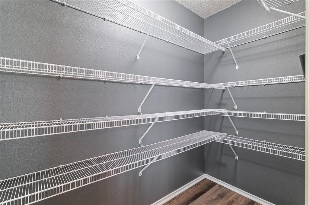 1448 Ridgecrest Drive Little Elm, TX 75068 - Photo 15 of 29 a view of a room with racks on the wall