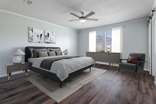 a bedroom with a large bed and a couch