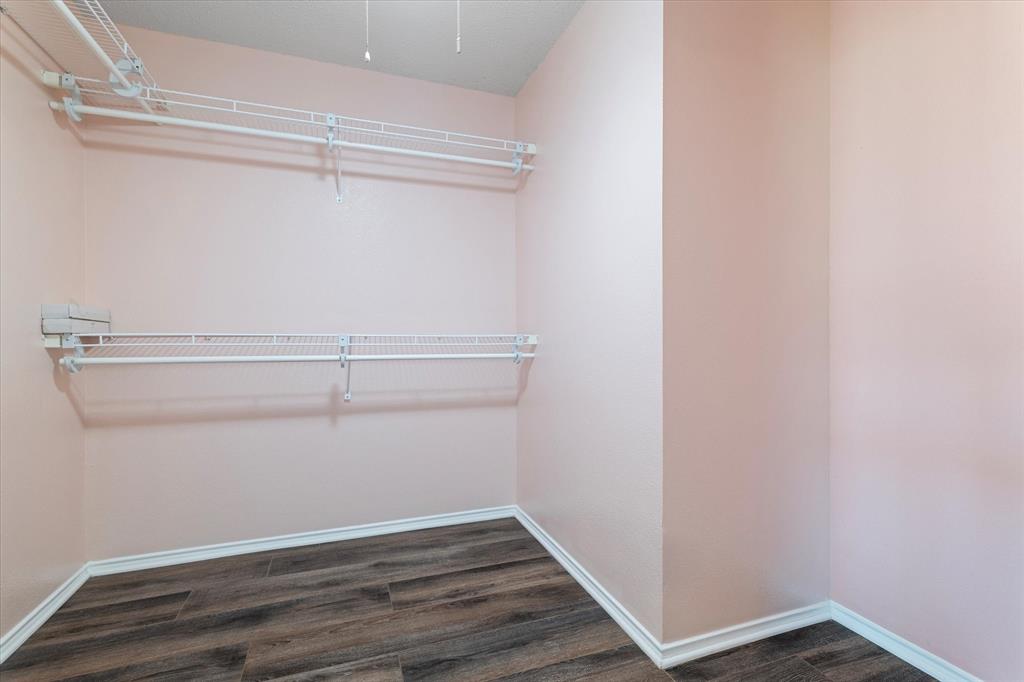 1448 Ridgecrest Drive Little Elm, TX 75068 - Photo 21 of 29 a view of an empty walk in closet