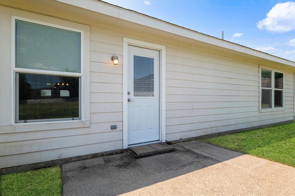 1448 Ridgecrest Drive Little Elm, TX 75068 - Photo 26 of 29 a view of a house with a yard