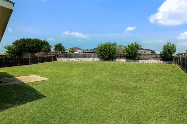 a view of a lake with a yard