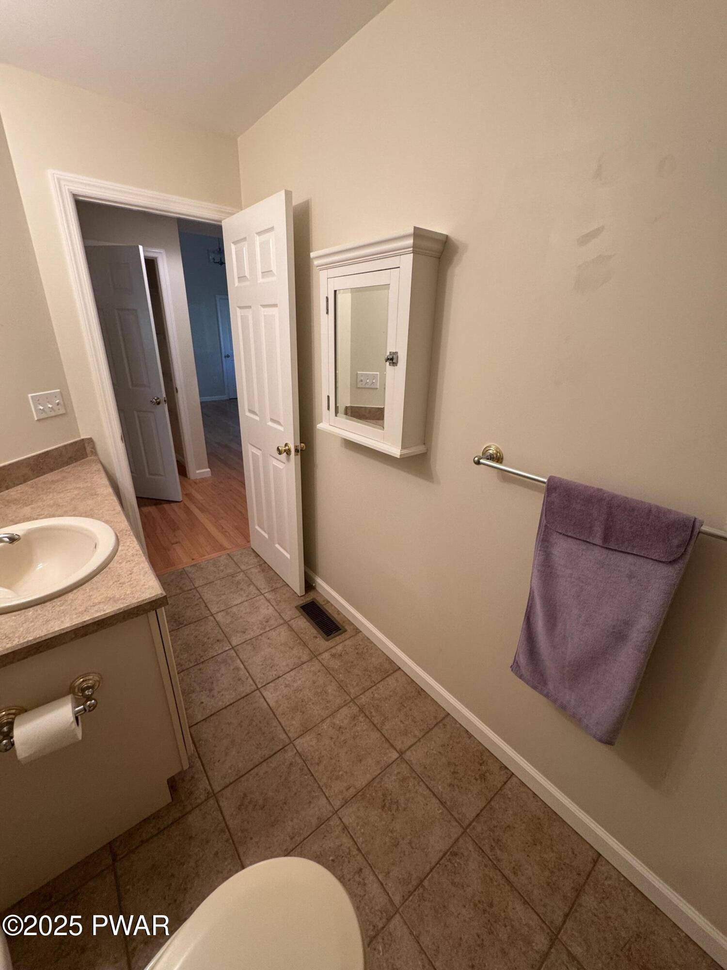 137 Rodeo Drive Hawley, PA 18428 - Photo 22 of 68 a bathroom with a toilet and a sink