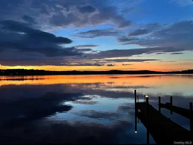 a bathroom with a toilet sink and a window
