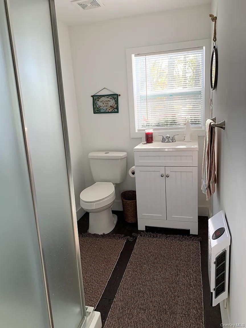206 Sunset Cove Road Newburgh, NY 12550 - Photo 14 of 23 a bathroom with a toilet sink and a window