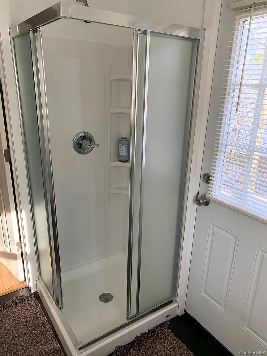 206 Sunset Cove Road Newburgh, NY 12550 - Photo 15 of 23 a bathroom with a glass door shower