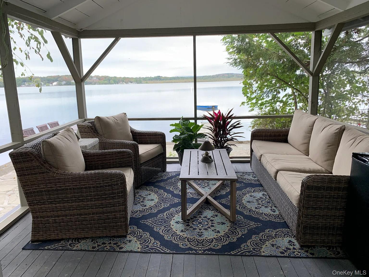 206 Sunset Cove Road Newburgh, NY 12550 - Photo 16 of 23 a living room with furniture and a floor to ceiling window