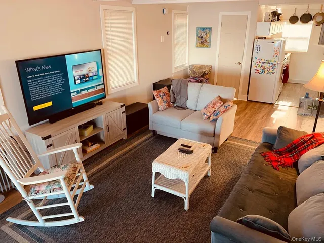 a bathroom with a toilet and a mirror